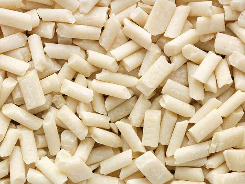 White gumbase pellets from a gumbase compounding machinery