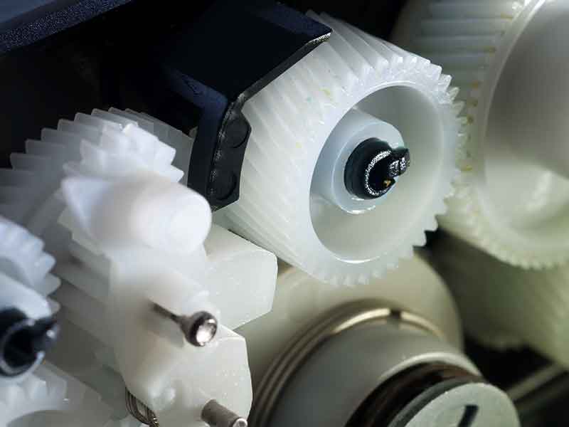 White gears of PA made with polyamide compounding systems.